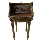 Louis XVI style armchair in wood and gilded stucco, 20th century.