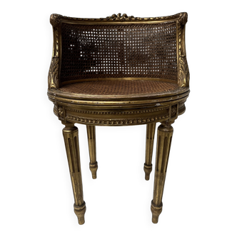 Louis XVI style armchair in wood and gilded stucco, 20th century.
