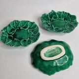 Set of three enamelled, emerald green, leaf-decorated faent cups