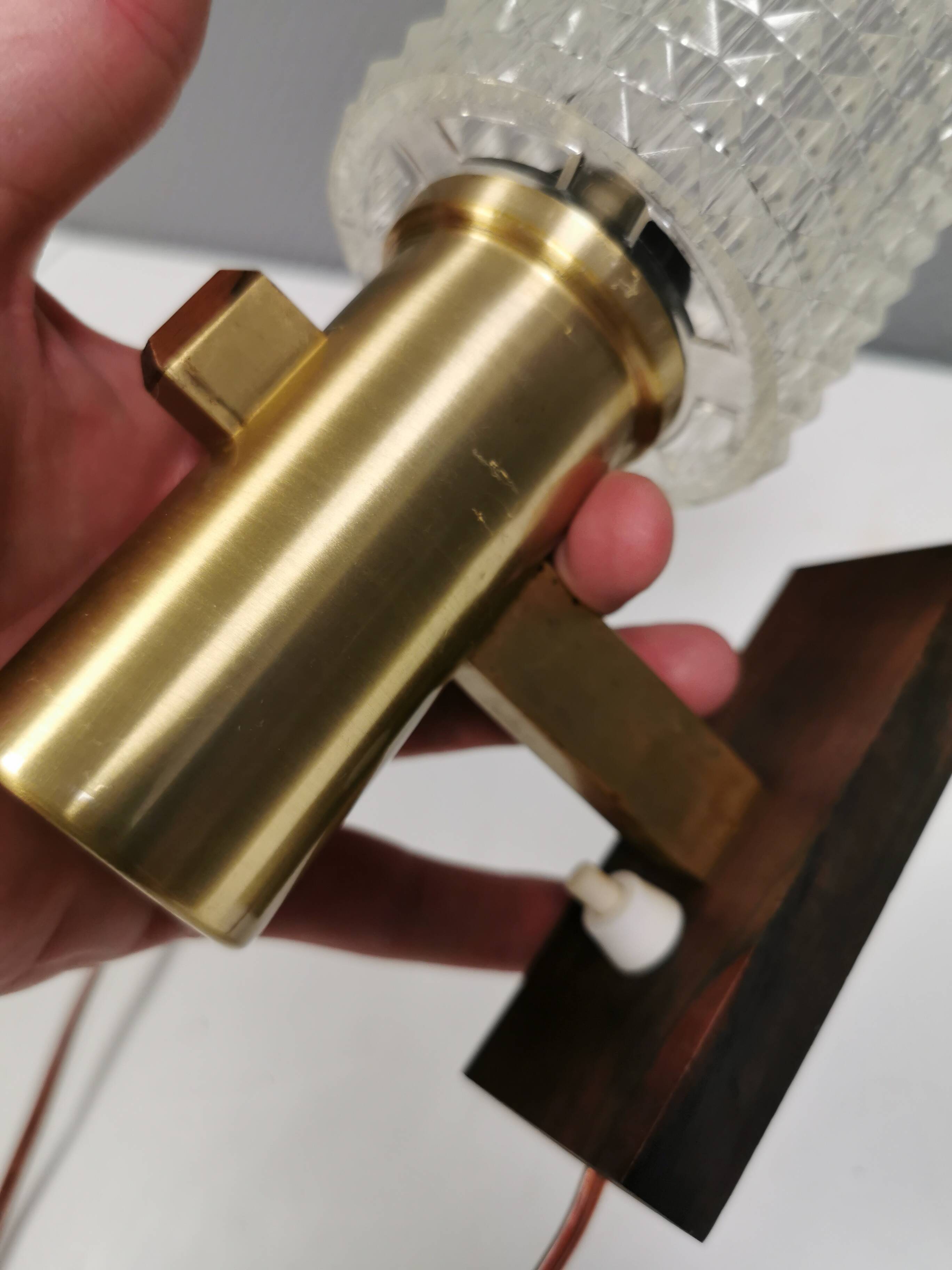 A set of Danish wall lamps, from the 1970s, in rosewood, aluminum and with pressed plastic shades