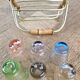 6 Old multicoloured liqueur glasses with bamboo stand