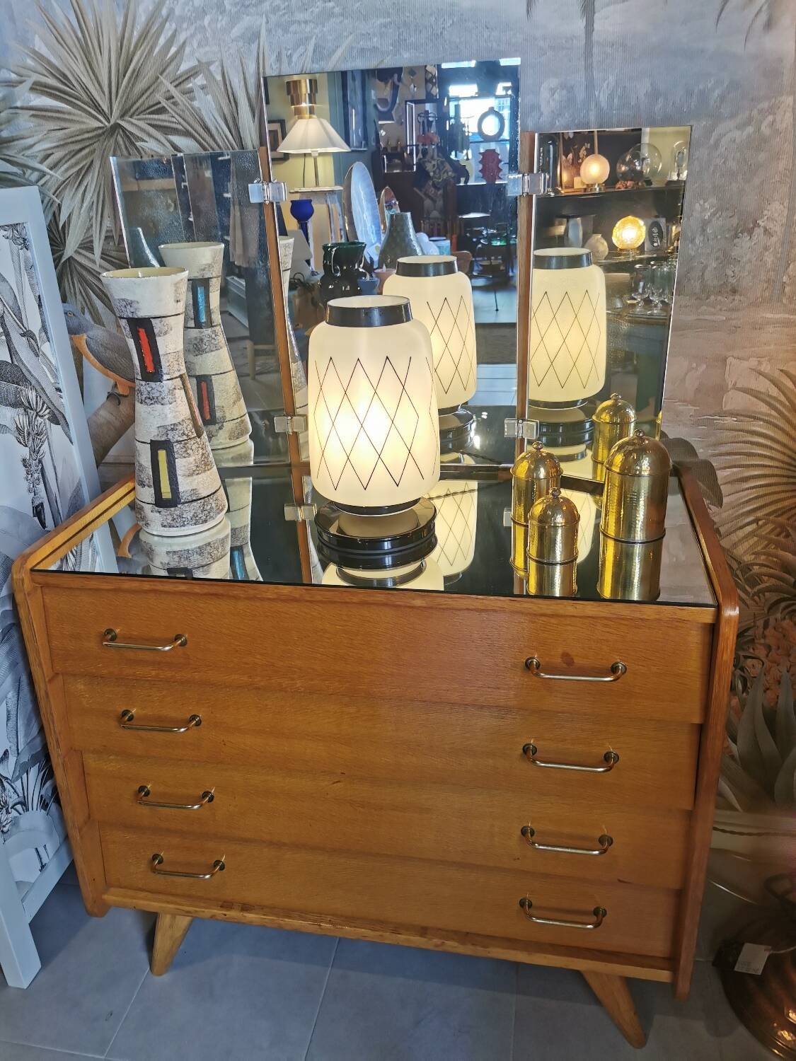 Vintage chest of drawers with compass legs and triptych mirror