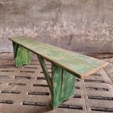 Old wooden bench side table grass green