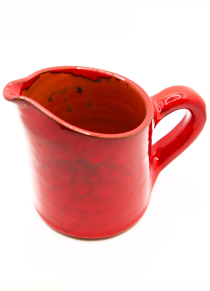 Bright red ceramic pitcher