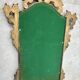 Carved and gilded wooden wall mirror.