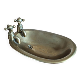 Old soap dish in the shape of a brass bathtub