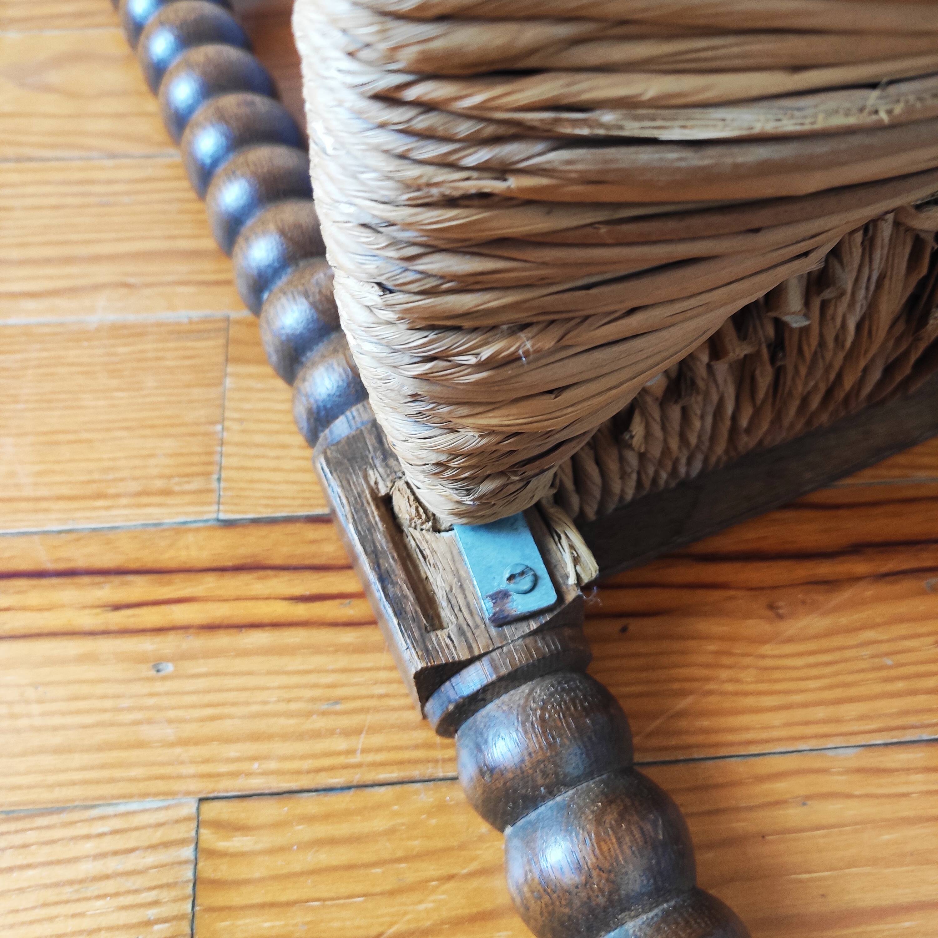 Antique corner chair made of turned wood spindle.