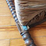 Antique corner chair made of turned wood spindle.