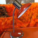 Orange articulated desk lamp