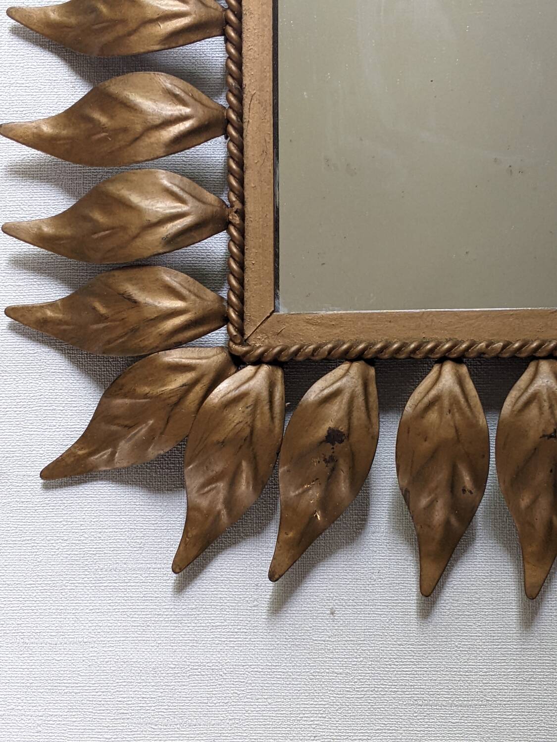 Vintage gold metal mirror with leaves from the 1950s.