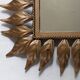 Vintage gold metal mirror with leaves from the 1950s.