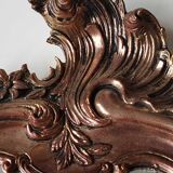 Pretty Baroque style mirror / Louis XV patinated with pink / golden copper reflections. Volutes, leafy shells