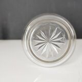 Crystal bottle with silver metal neck rim