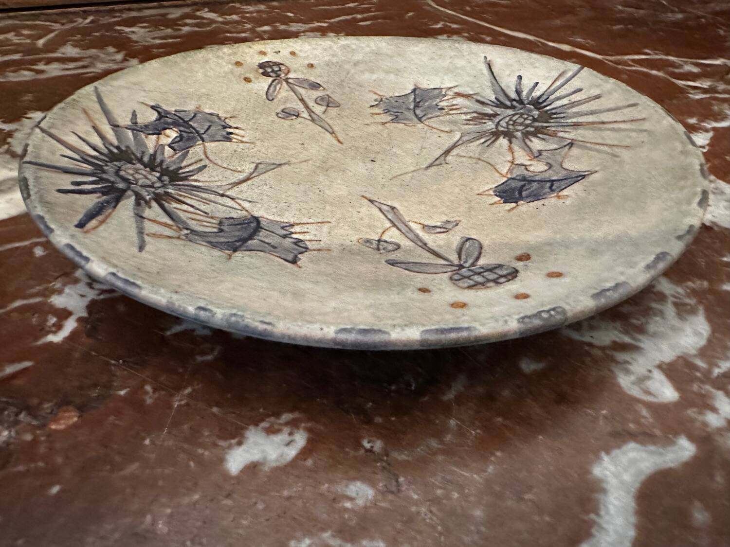 Ceramic plate signed by Marie-Madeleine Jolly – thistle decoration – year