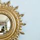 Ancien miroir doré oeil de sorcière soleil