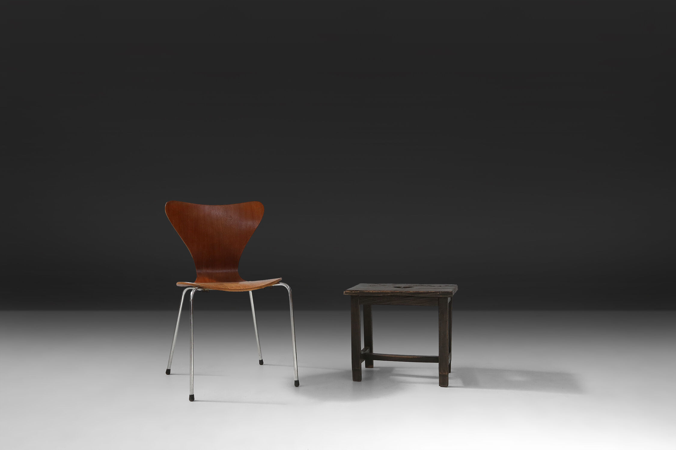 Rustic black wooden stool, Ca.1920