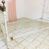 Old white metal and brass bed