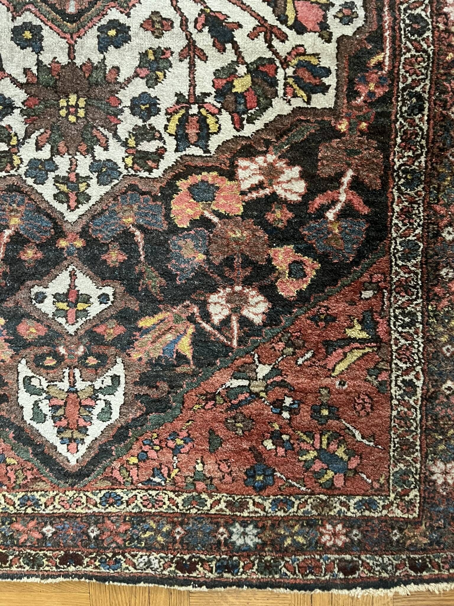 Antique handmade Hamadan Persian rug, ivory medallion on dark background 148x103.