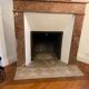 Marble fireplace surround with closed hearth frame.