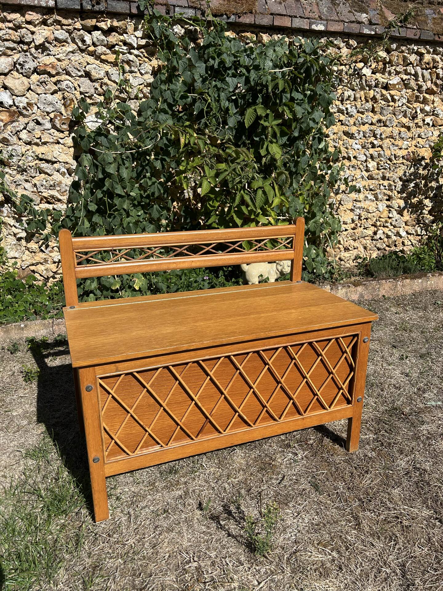 Vintage 1960s bank chest in light oak and rattan weaving.