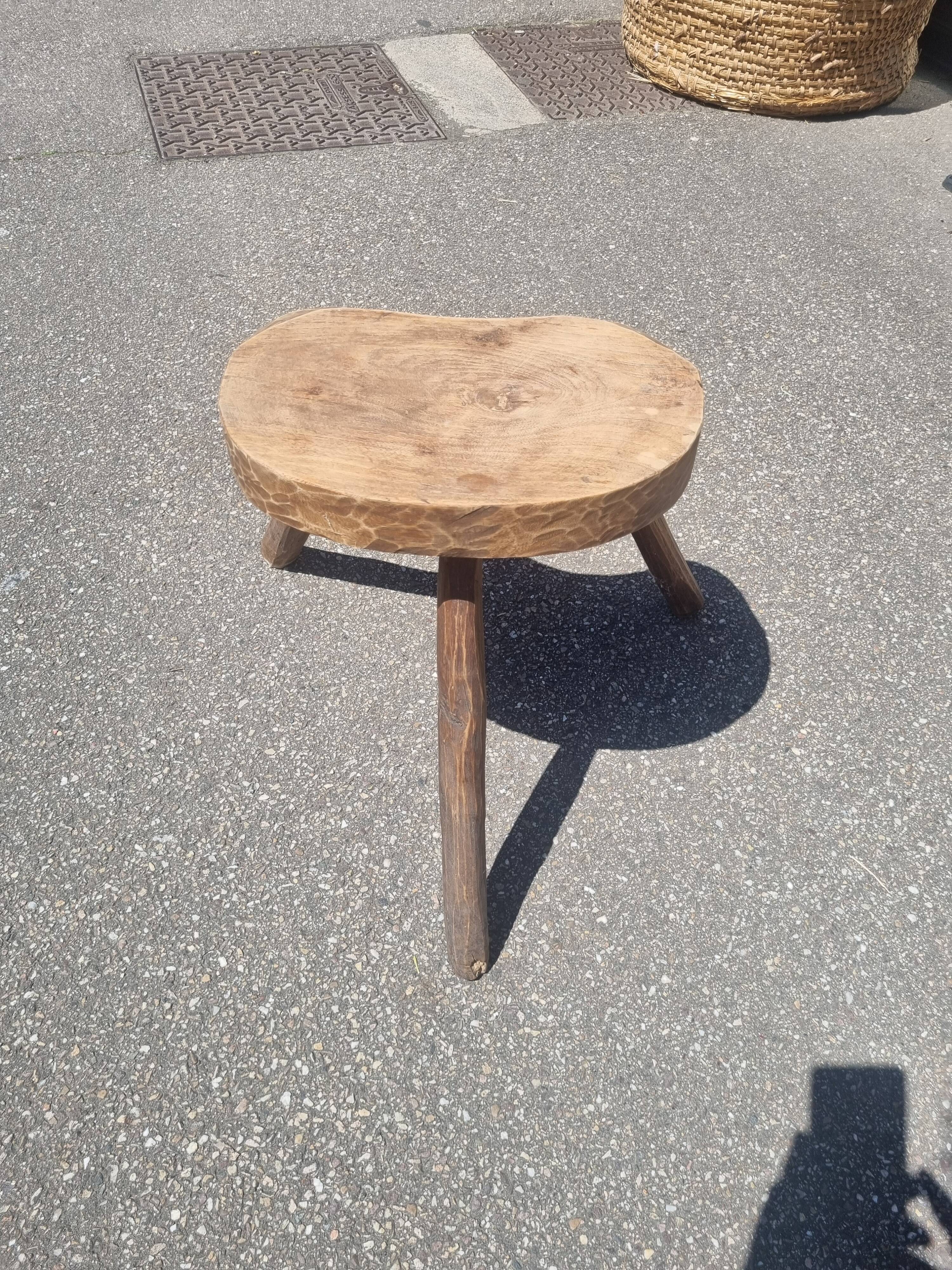 Old wooden tripod stool