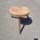Old wooden tripod stool