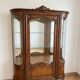 Louis XV display cabinet ensemble in solid brown wood.