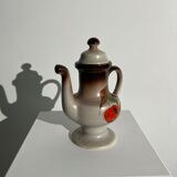 Vintage stoneware teapot with flower and fruit patterns