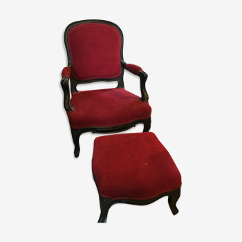 Old children's armchair with foot rests