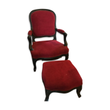 Old children's armchair with foot rests