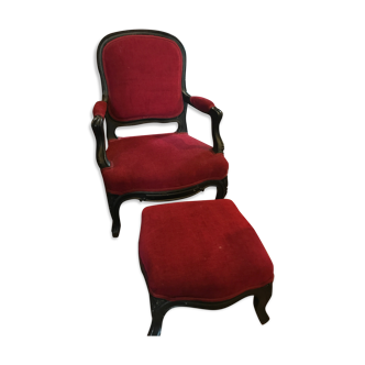 Old children's armchair with foot rests