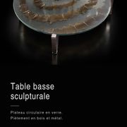 Round coffee table with double glass top, spiral carved decoration.