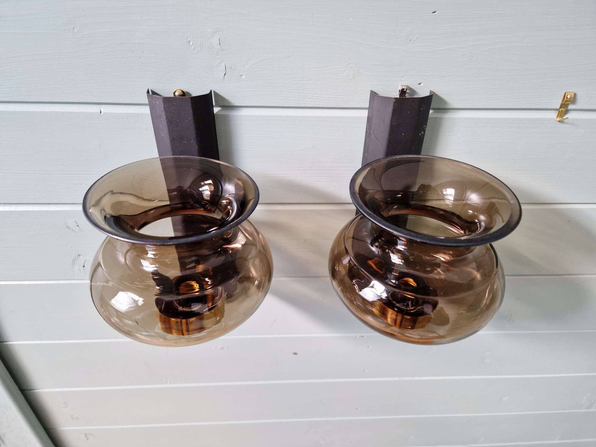 Pair of wall sconces in brass and smoked glass, 1960s.