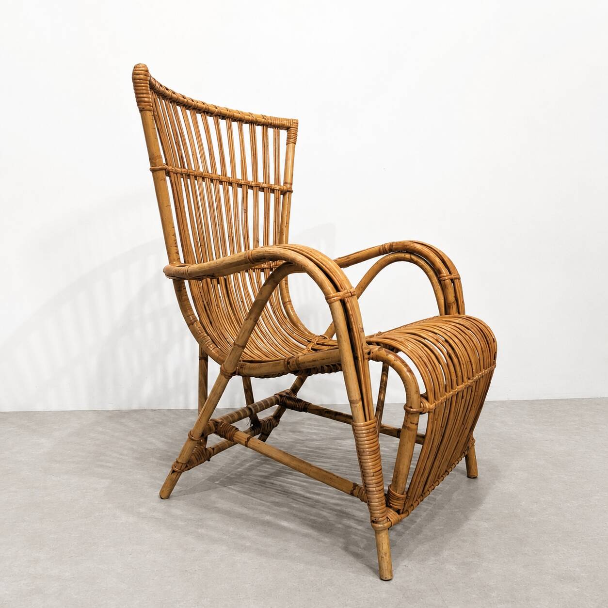 Vintage armchair from the 70s in natural rattan.