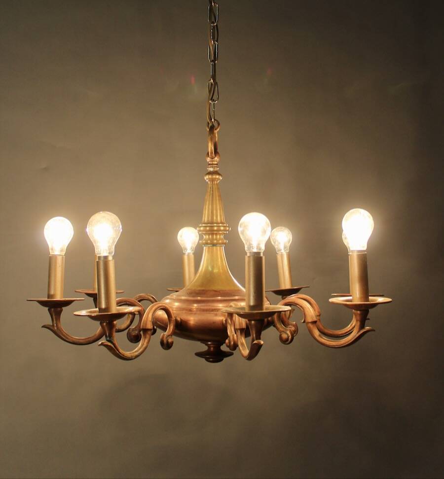 Bronze chandelier with double patina and 8 light arms.