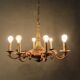 Lustre en bronze double patine à 8 bras de lumière