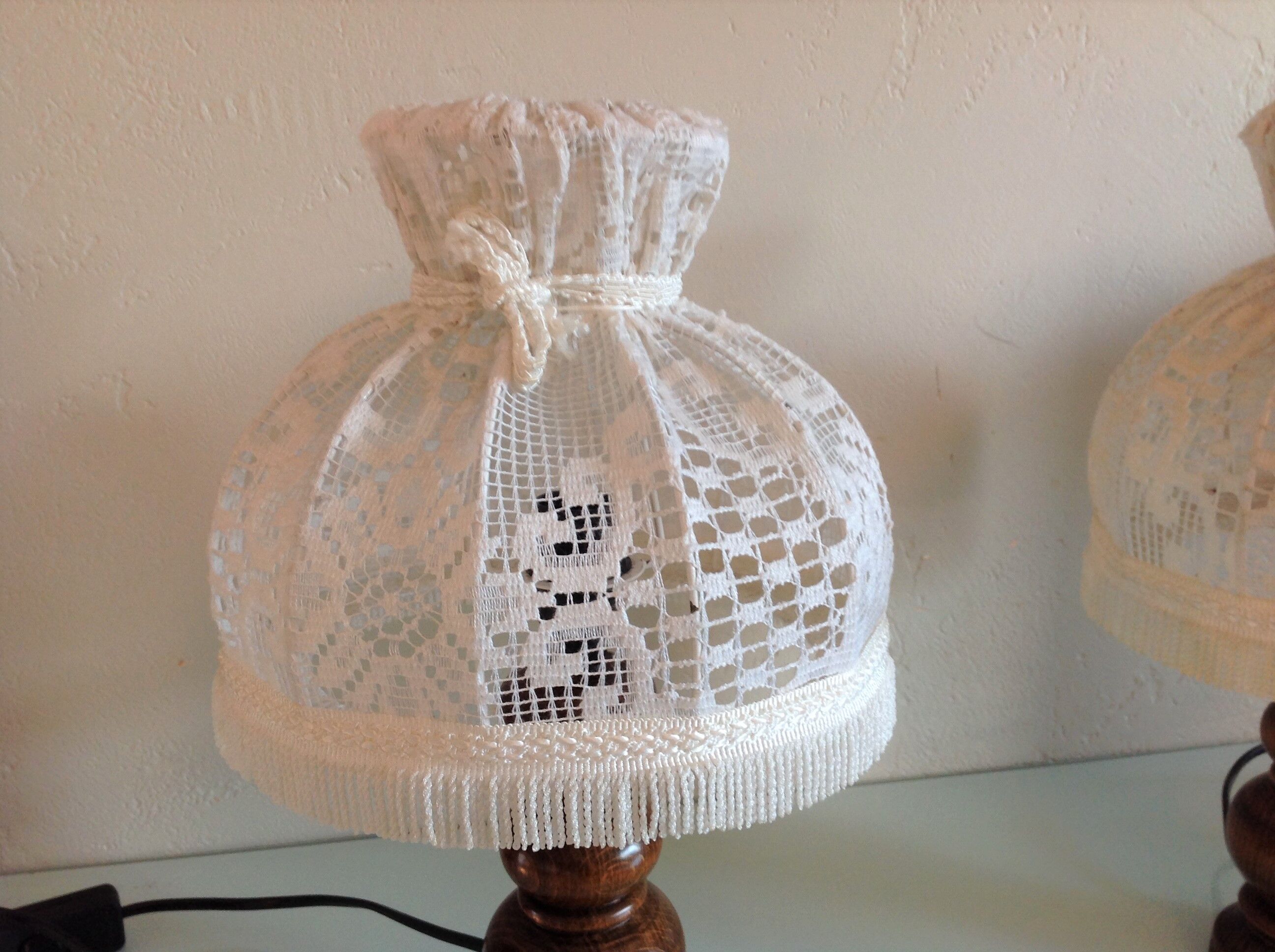 Pair of turned wooden bedside lamps and lace/vintage lampshade 60s-70s