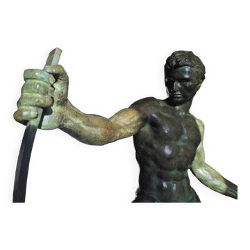 bronze sculpture athlete bending an iron bar by Jean de Roncourt on an art deco marble base
