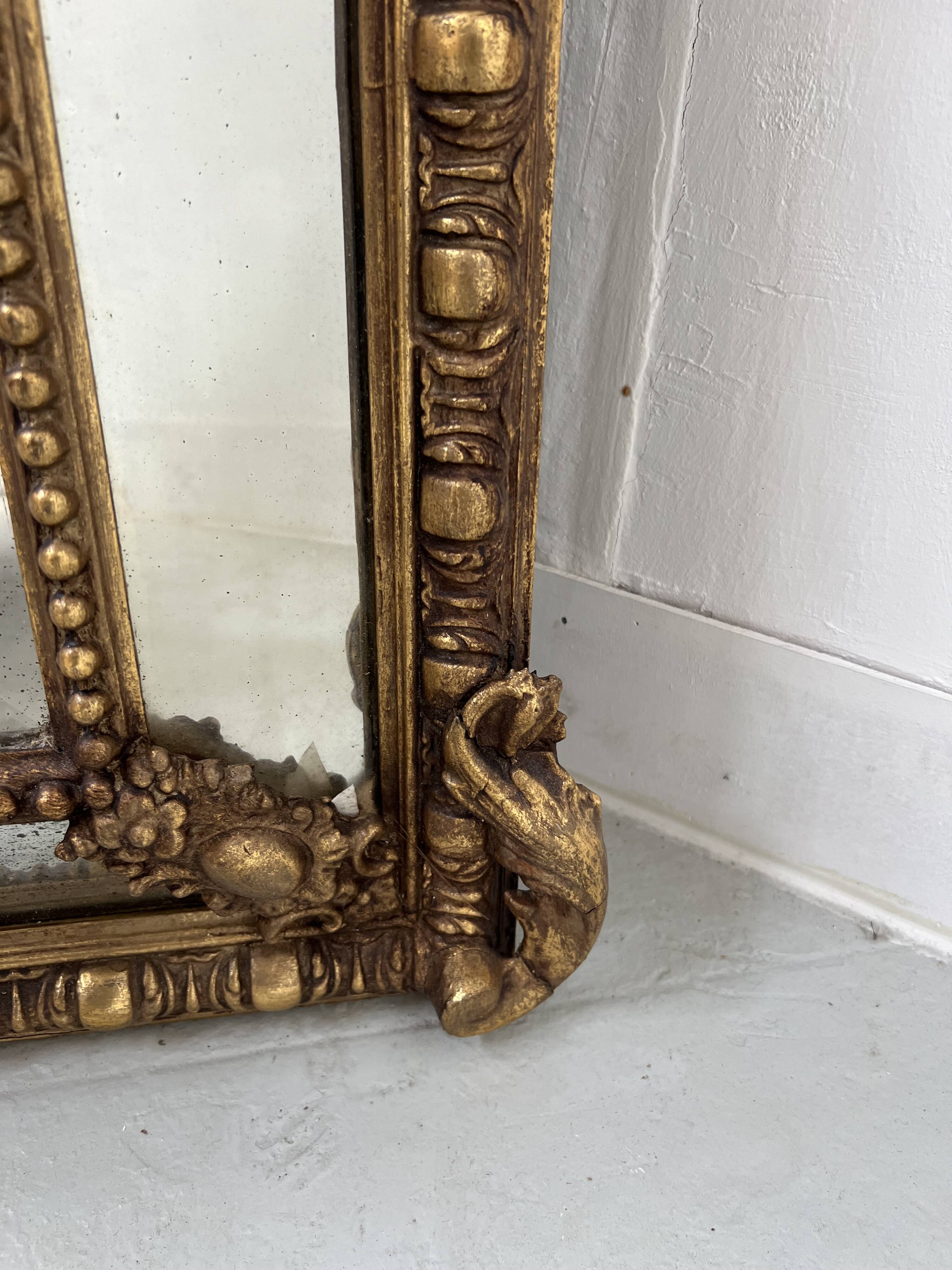 Louis XVI style mirror with parecloses in wood and gilded stucco, 19th century