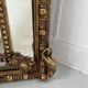 Louis XVI style mirror with parecloses in wood and gilded stucco, 19th century