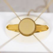Lampe en bronze doré de forme H. 20e siècle.
