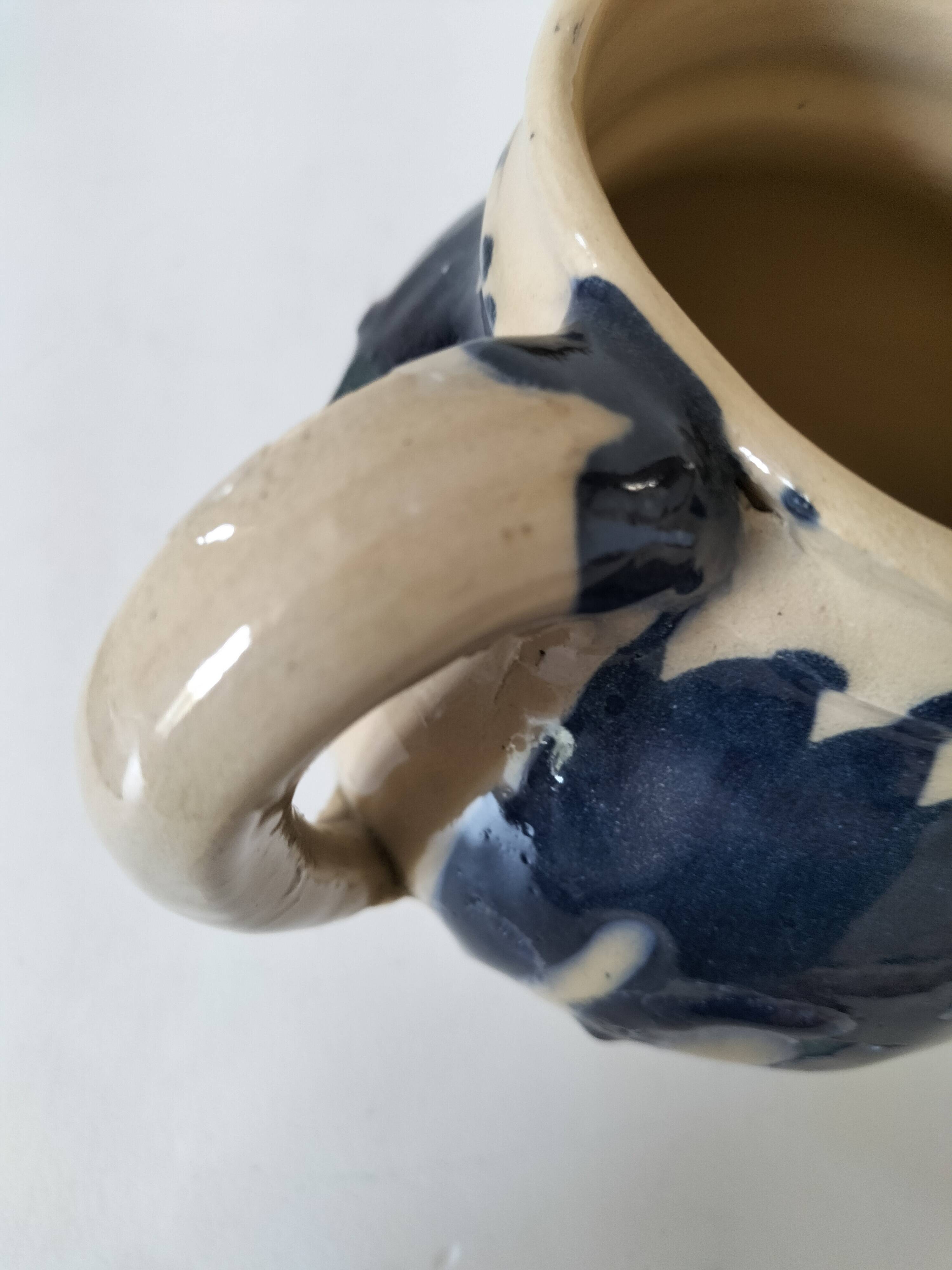 handcrafted ceramic jug with navy blue drip glaze.