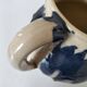 handcrafted ceramic jug with navy blue drip glaze.
