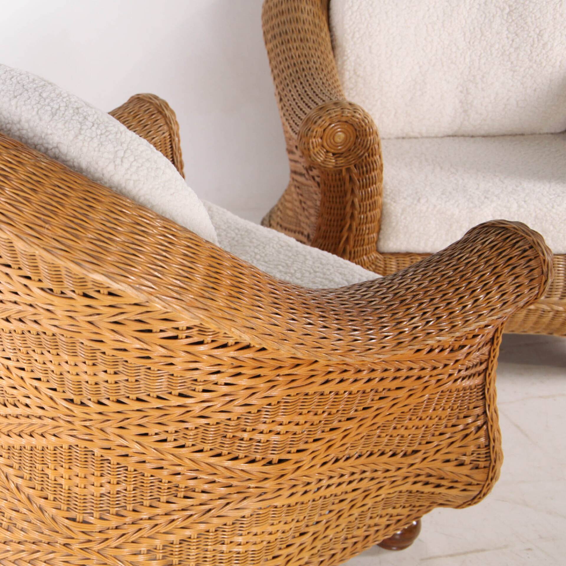 Pair of woven wicker armchairs