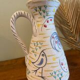 Pitcher with naive bird decor