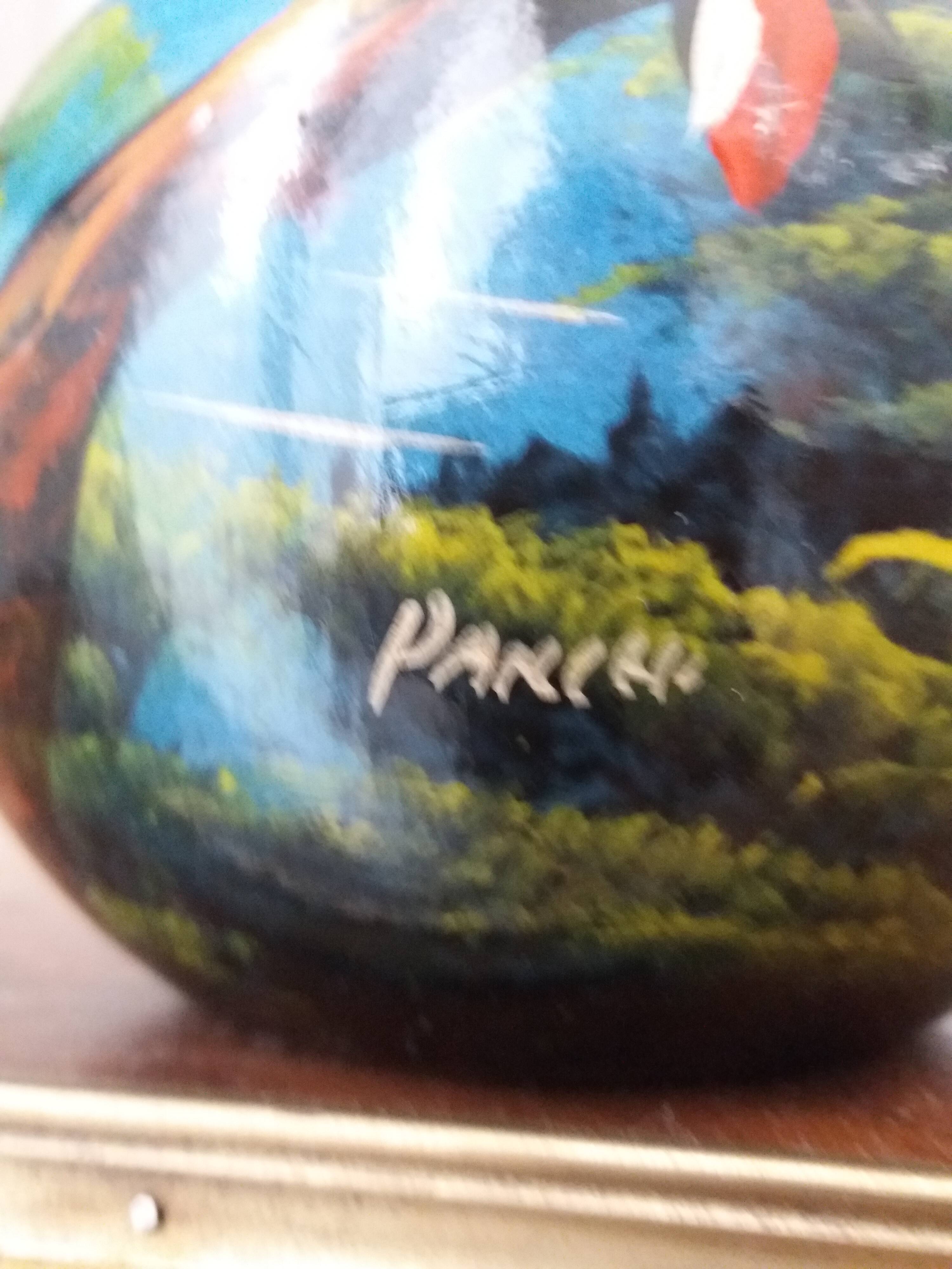 Mexican popular art vase decorated with parrots and toucans.
