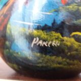 Mexican popular art vase decorated with parrots and toucans.