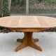 Round extendable Scandinavian dining table in Baumann style oak with central leg