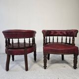 Pair of barrel chairs in turned wood and burgundy leather – Productio
