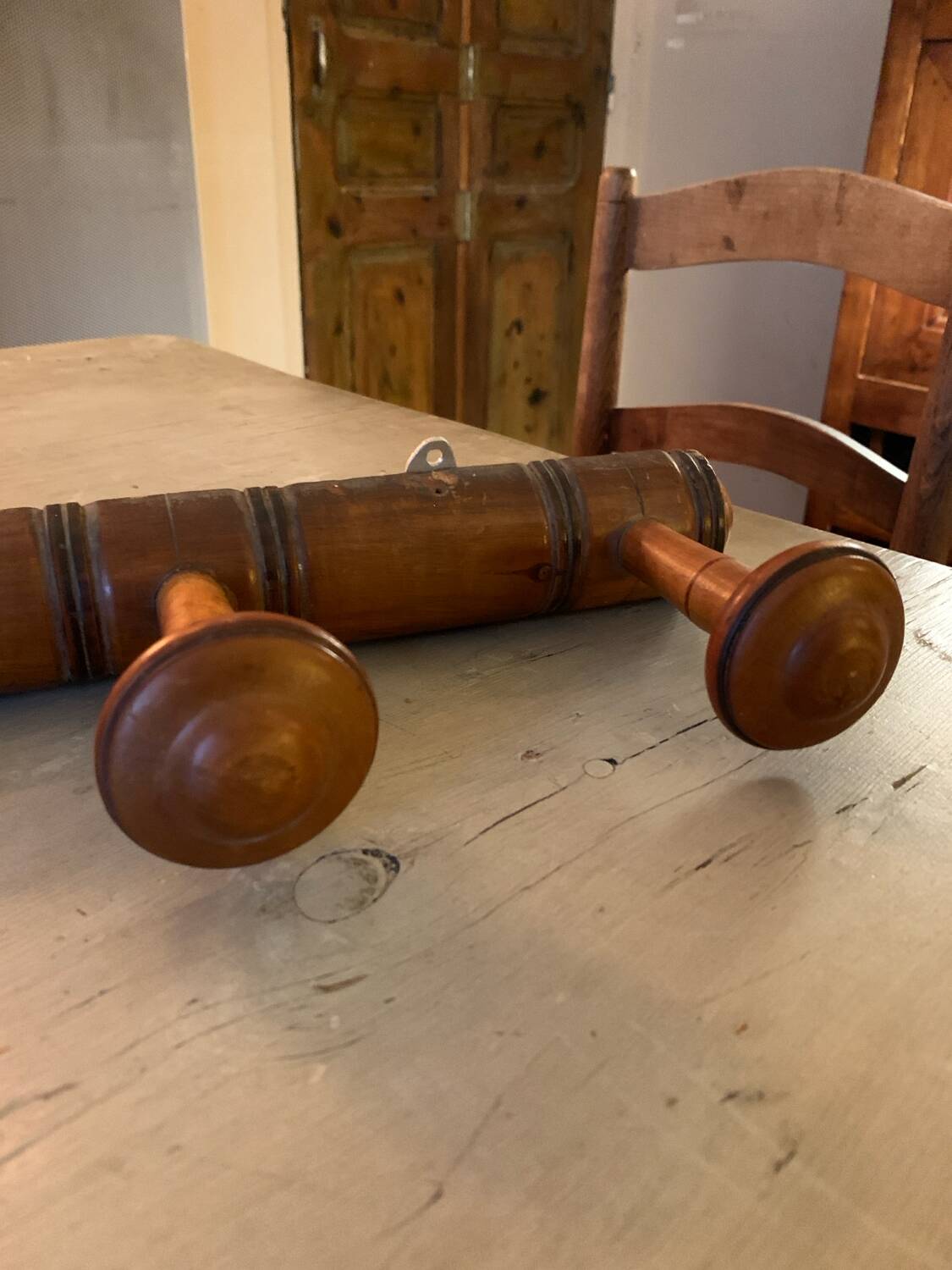 Coat rack with six wooden hooks